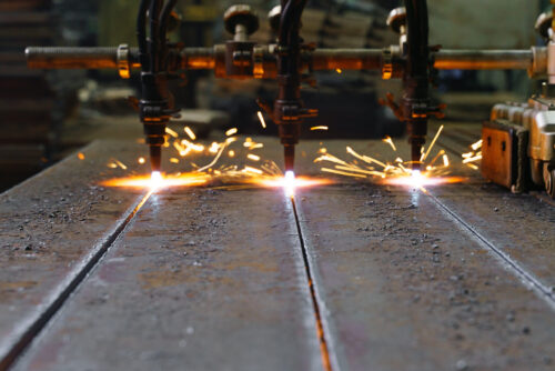 The machine cuts metal sheets with gas Jet Erosion